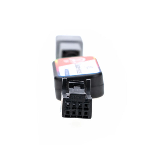 A rectangular ASS Disable Bypass module with colorful labeling, featuring two connectors (gray and black) and a toggle switch marked "OFF" for disabling vehicle systems. There is a 8-pin female connector on one end.