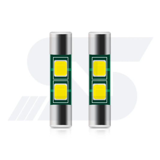 Two cylindrical LED car bulbs with silver ends and dual yellow light panels on a green circuit board, displayed side by side on a white background.