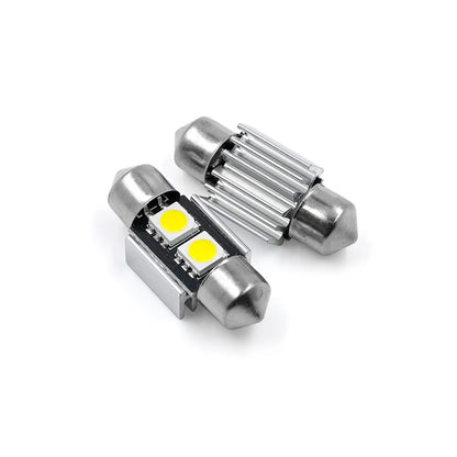 Two cylindrical LED fuse bulbs with metallic ends, shown front and back; one side displays dual yellow LED chips, the other side a small resistor component.