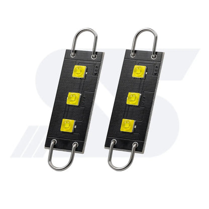 Pair of compact LED light modules featuring three bright yellow LEDs each, mounted on black rectangular boards with metal loops for easy attachment or suspension.
