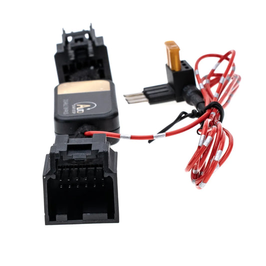 A black auto disable bypass module with connectors, featurs a red wire and a yellow fuse tap and shows its interior with a 12-pin male connector . 