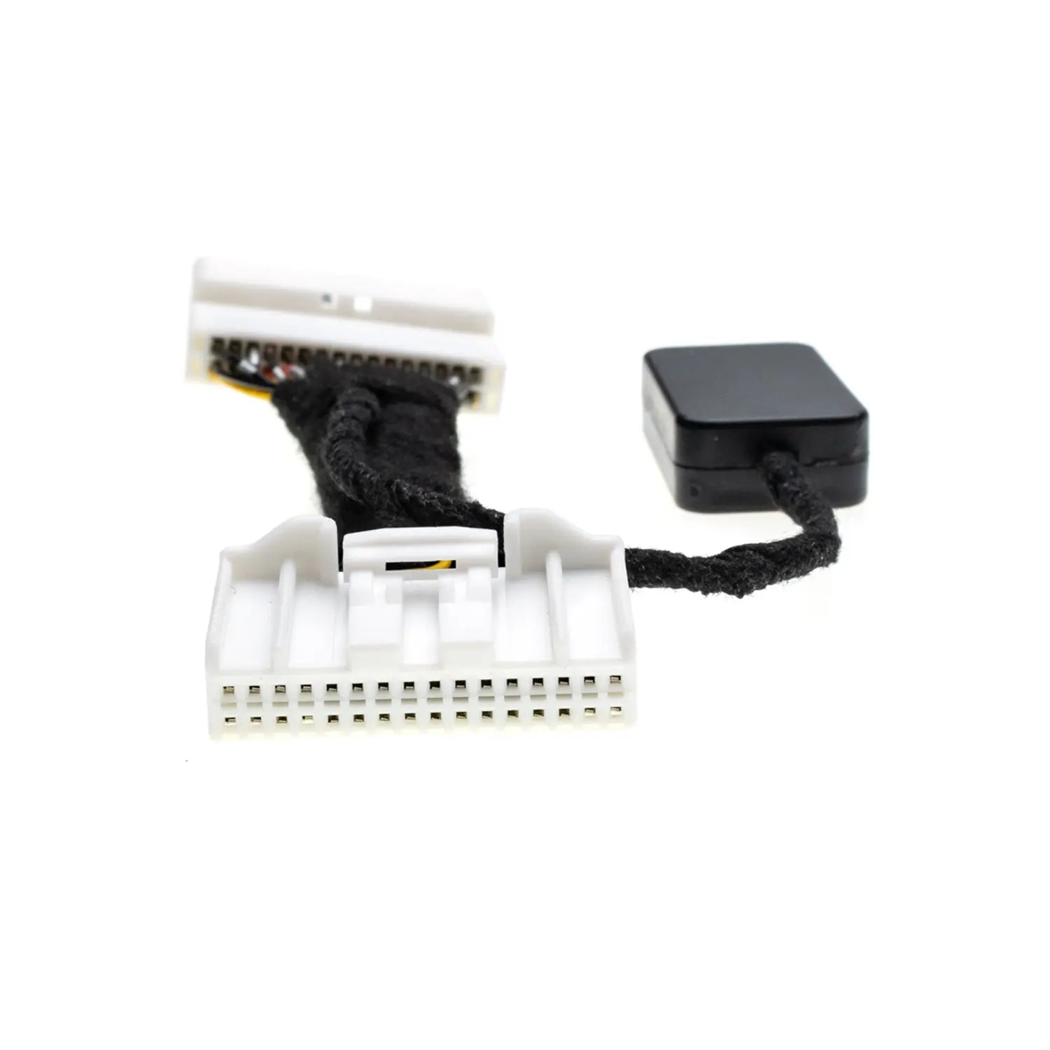 The image shows a close-up of an Idle Stop Disable Bypass device with two white multi-pin connectors and a black module attached via a short cable.