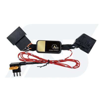 A black auto start-stop disable bypass module with gold label, black connectors, red/black wires and a fuse tap.