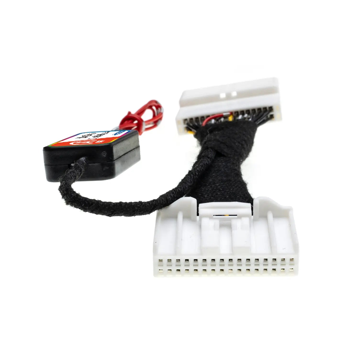 Close-up of an Idle Stop Disable Bypass device showing two white multi-pin connectors, braided wiring, and a compact control module with red wire for installation.