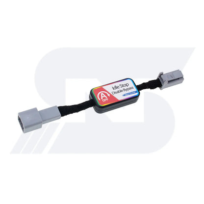 An Idle Stop Disable Bypass device with two gray connectors and a labeled module, designed to plug into a vehicle system to deactivate auto start-stop function.