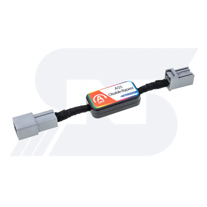 A black ASS Disable Bypass device with "A OFF" and "First Choice" labels, featuring gray connectors on both ends, used for automotive applications.